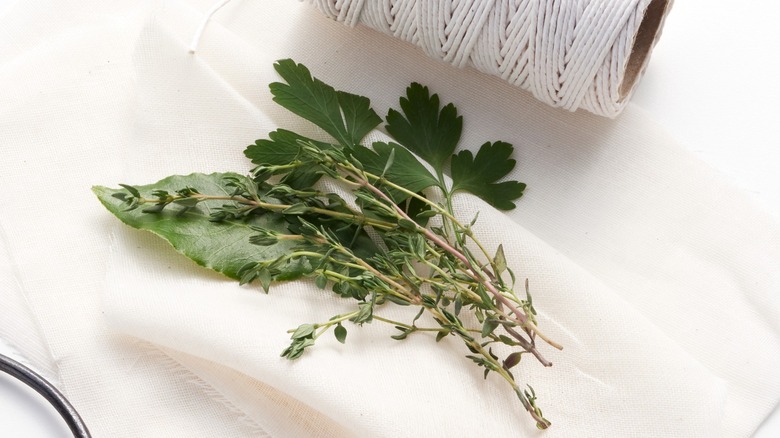 A small collection of herb stems, ready to be made into a bouquet garni