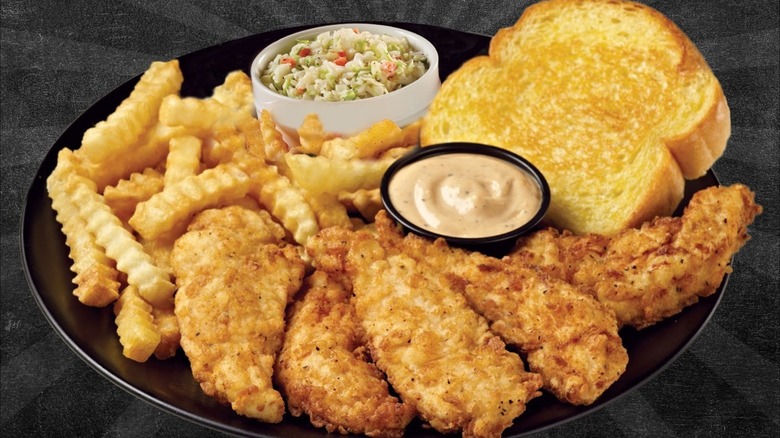 Huey Magoo's chicken tenders plate with sides and toast