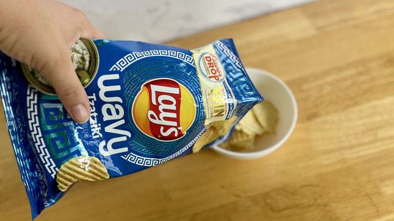 pouring Tzatziki chips