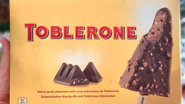 Hand holding box of Toblerone ice cream bars