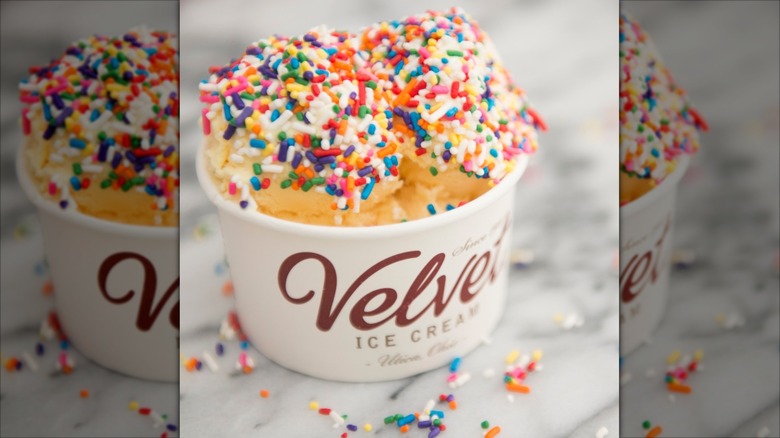 Cup of Velvet ice cream with sprinkles