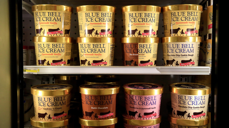 Blue Bell ice cream pints in grocery store freezer