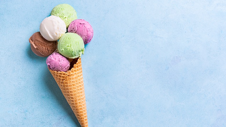 multi-colored scoops of ice cream in a waffle cone