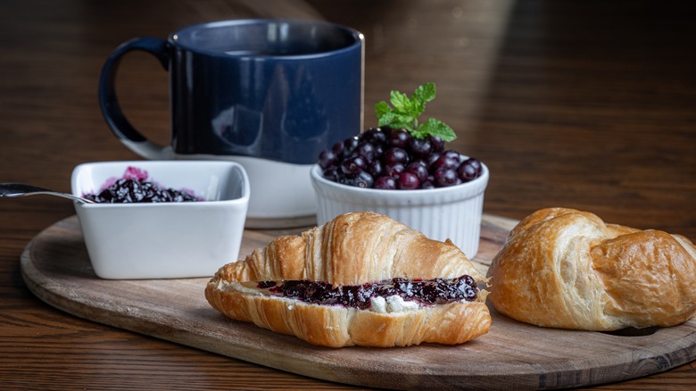 Huckleberry jam and cheese on a croissant