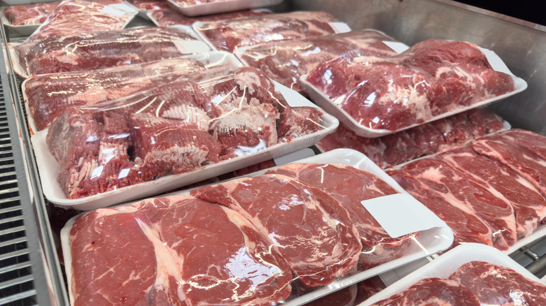 A store freezer full of raw meat in packaging