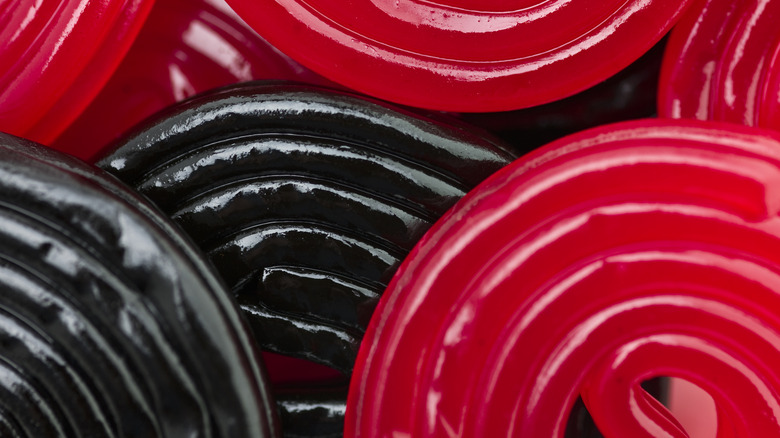 A close up shot of black and red licorice spirals