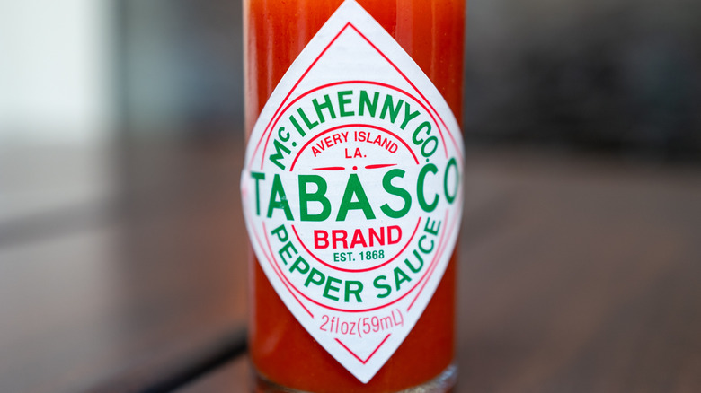 A close-up of a bottle of Tabasco sauce