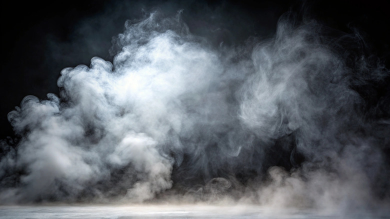 White smoke against a black background