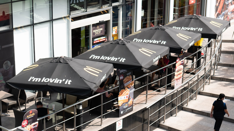 McDonald's table umbrellas over tables with "I'm Lovin' It" slogan