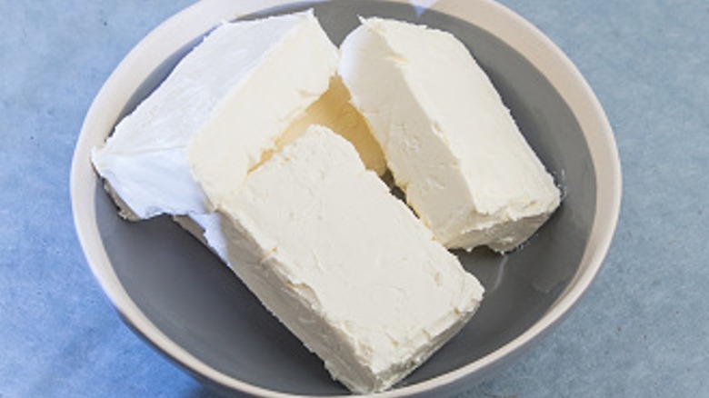 Cream cheese in small white bowl