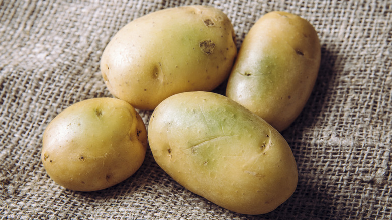 raw potatoes on burlap