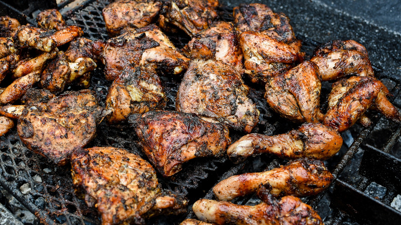 Caribbean jerk chicken on a grill