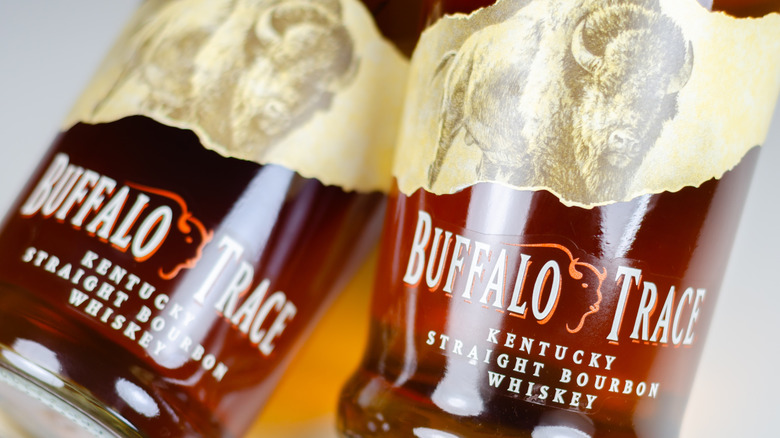 A close up shot of two bottles of Buffalo Trace bourbon