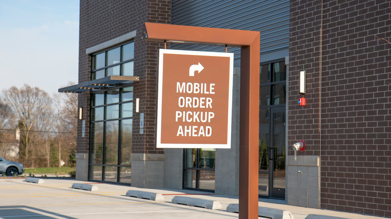 a sign outside Chipotle for mobile pickups