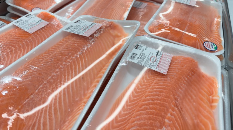 Packages of Costco fresh-caught salmon sit in the refrigerated section