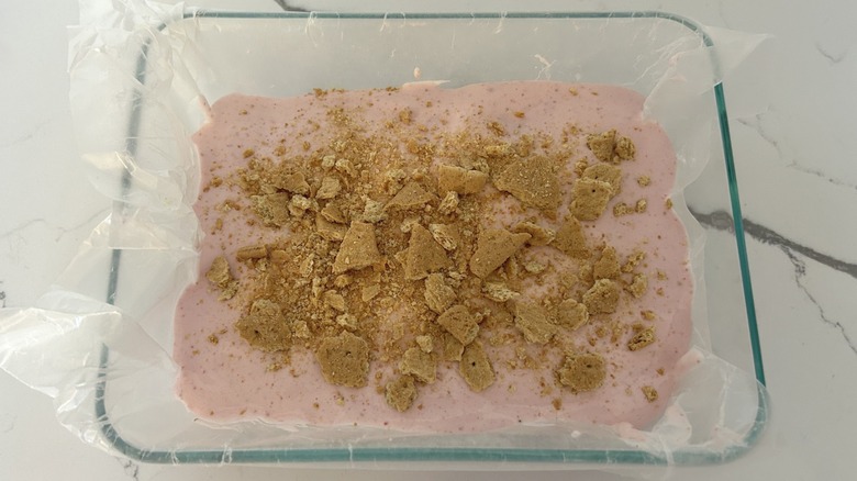 Strawberry cottage cheese ice cream in a dish with graham crackers