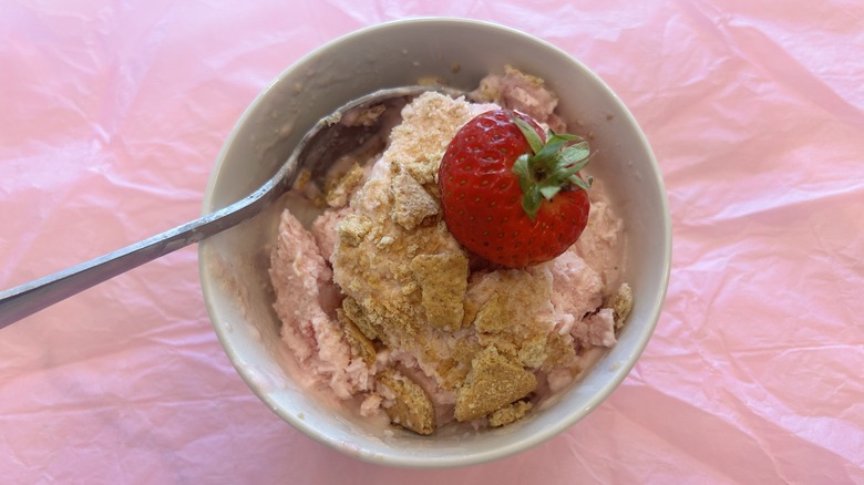 scoop of cottage cheese strawberry ice cream in a small bowl