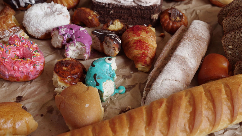 Half-eaten donuts and pastries from the trash