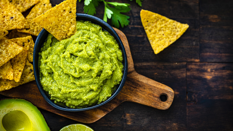 bright green guacamole with tortilla chips