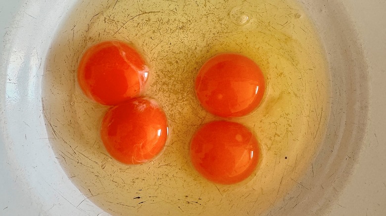 bright orange egg yolks in a bowl