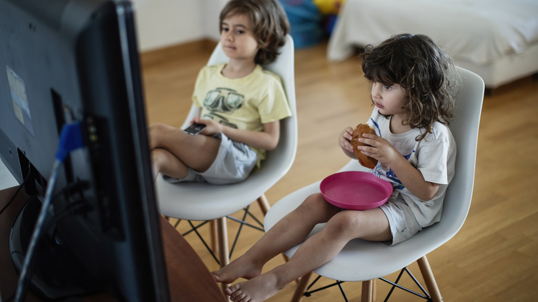 Children eating in front of the TV