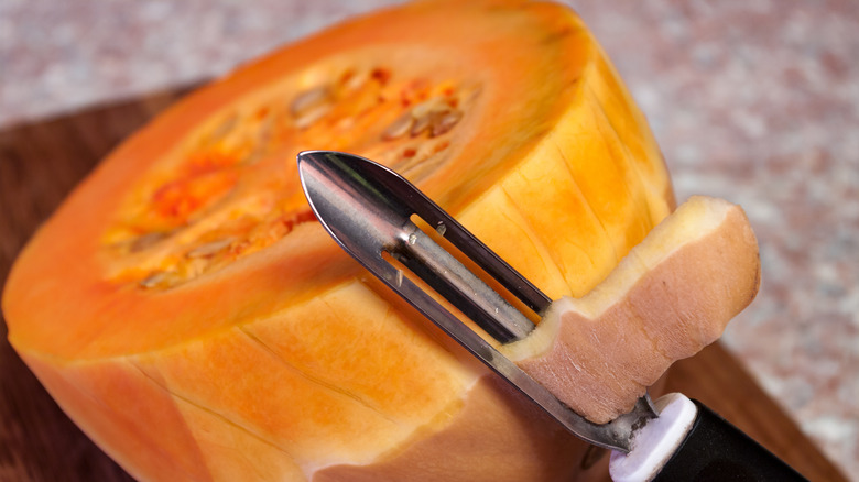 Peeling a pumpkin