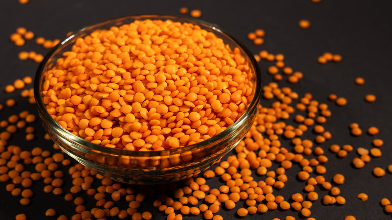 A bowl full of red lentils.