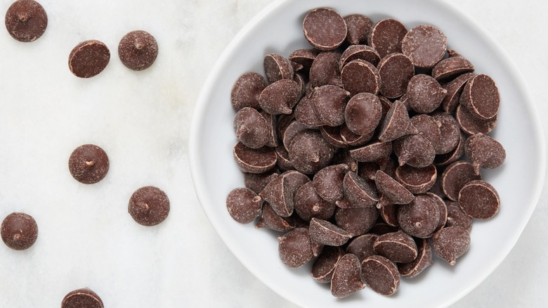 Chocolate chips sitting in a bowl