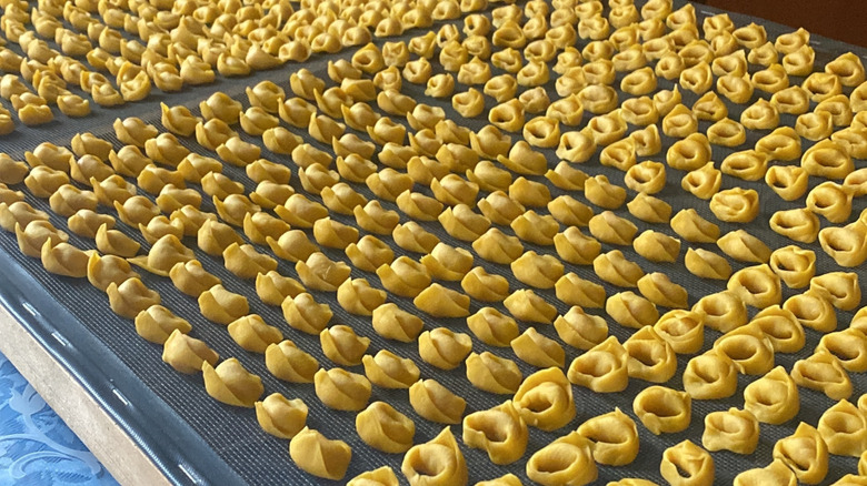 A table full of uncooked tortellini