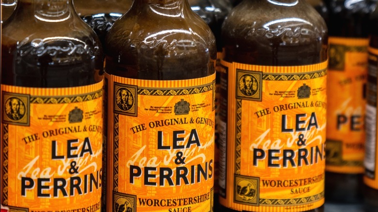 Bottles of Lea & Perrins Worcestershire sauce on a supermarket shelf.