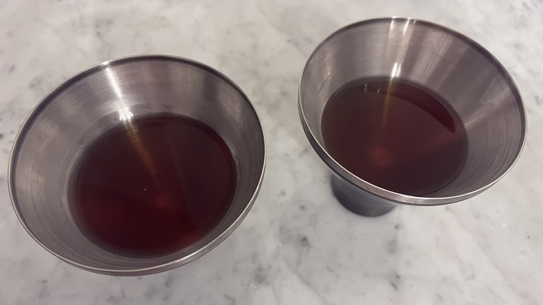 Two bourbon cocktails in matching glasses