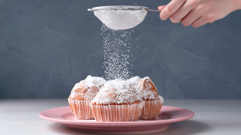 powdered sugar on muffins