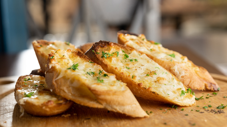 Garlic bread on a wooden board