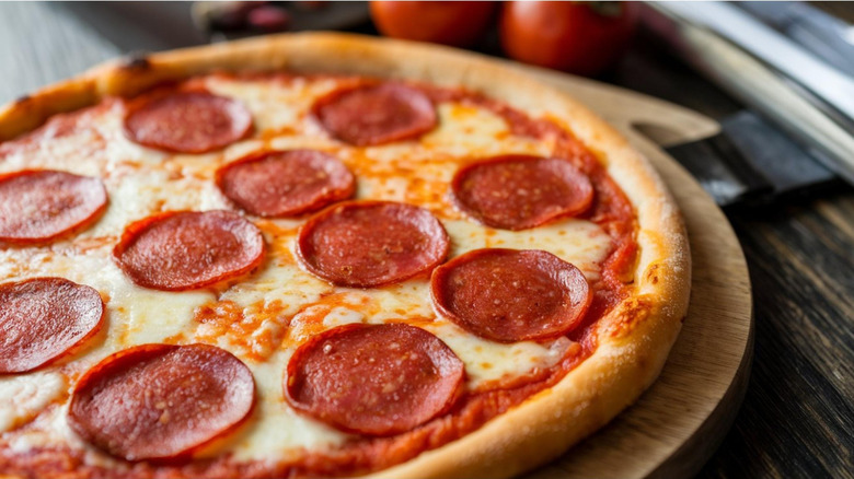 Pepperoni pizza on cutting board