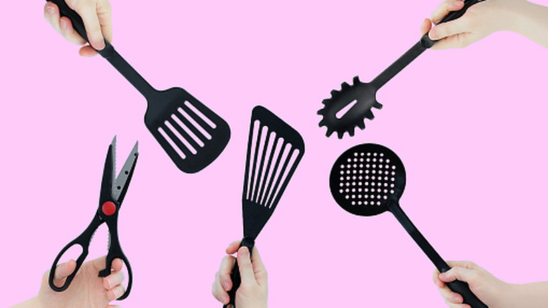 black plastic kitchen utensils like spatula and large spoon