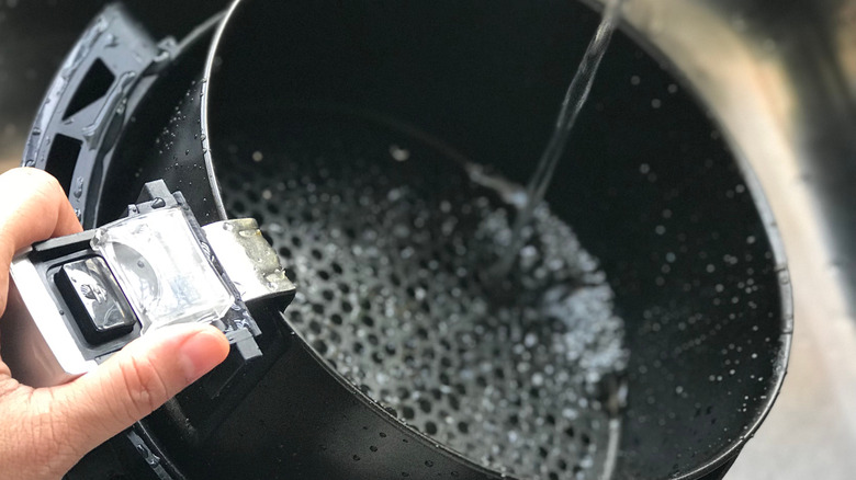 Water pouring into air fryer basket