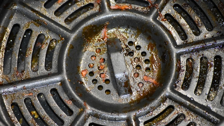 Close up of grime on the inside of an air fryer