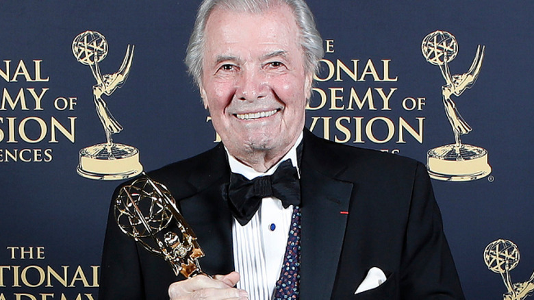 Jacques Pépin smiling at a red carpet event and holding an award