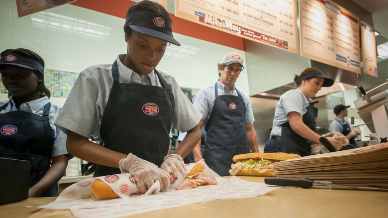 Jersey Mike's workers prepping sandwiches