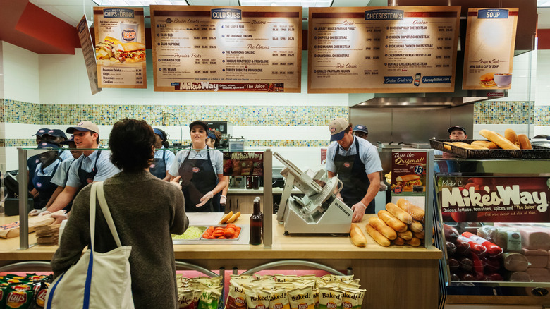 Jersey Mike's workers serving a customer