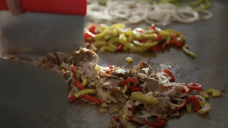 Food cooking on hot grill at Jersey Mike's