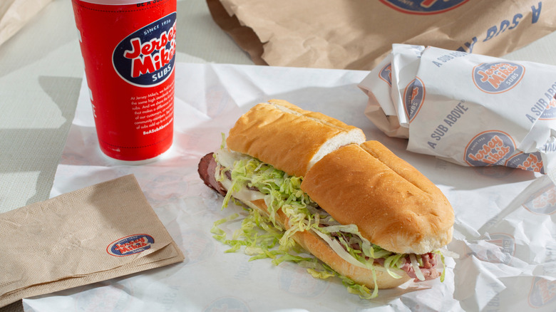 Jersey Mike's sandwich cut in half with fountain drink