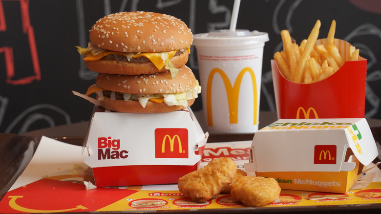 A pile of different McDonald's foods sitting on a tray.