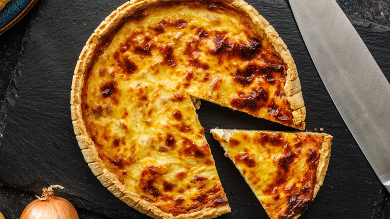 quiche lorraine on cutting board