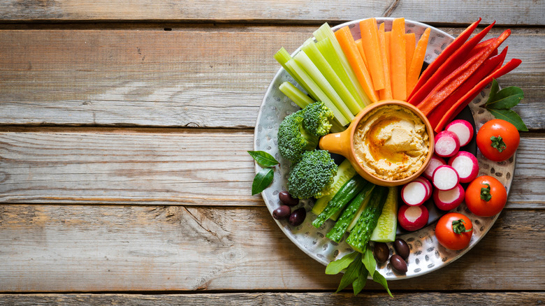 Raw vegetable plate with hummus dip