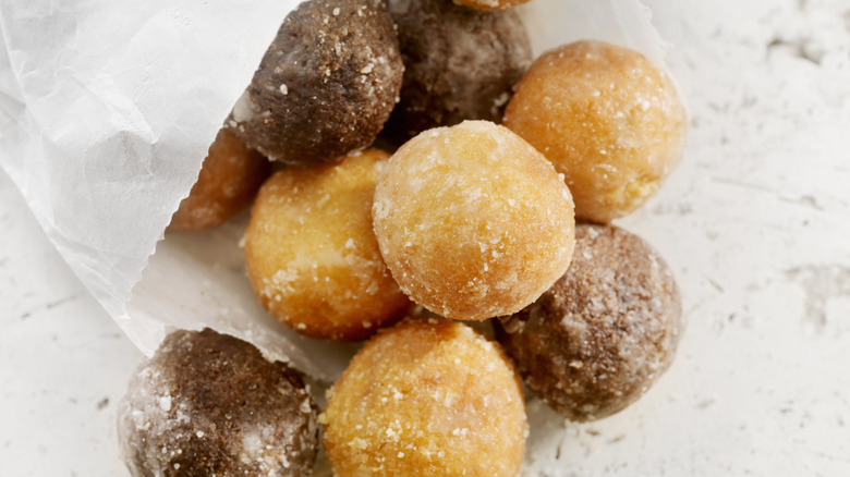 A bag of donut holes on a marble counter