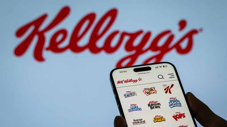 The Kellogg's logo in the background, a phone displaying all of the sub-brands on Kellogg's in the foreground