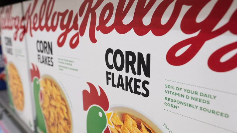 Boxes of Kellogg's Corn Flakes on store shelf