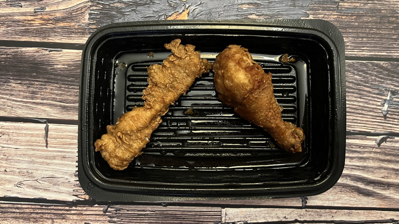 one KFC tender and piece of fried chicken