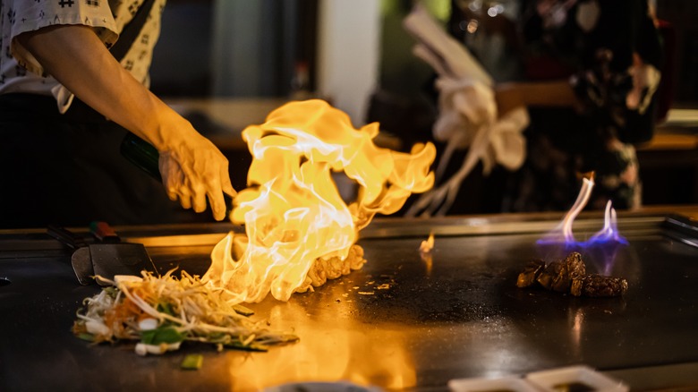 Chef cooking on teppanyaki grill